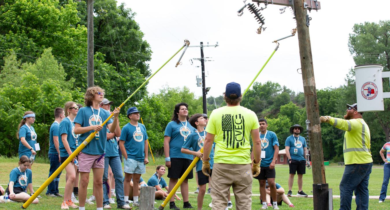 Students learn to insert a fuse at Energy Camp.